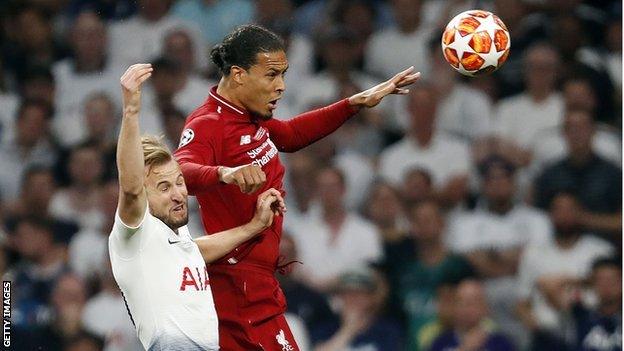 Tottenham striker Harry Kane and Liverpool defender Virgil van Dijk compete for a header during the Champions League final in Madrid