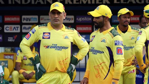 Chennai Super Kings team-mates MS Dhoni (left) and Ravindra Jadeja (right) talk on the sidelines