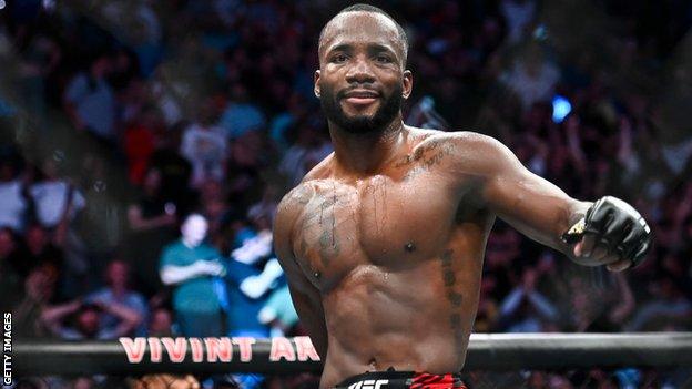 Leon Edwards celebrates after beating Kamaru Usman