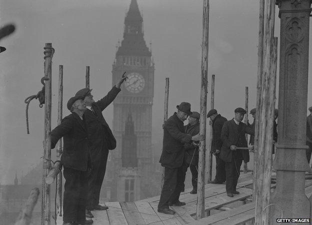 Restoration workers restore the Central Tower of the House of Commons, 1929