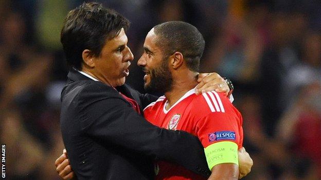 Chris Coleman and Wales captain Ashley Williams celebrate after they beat Russia