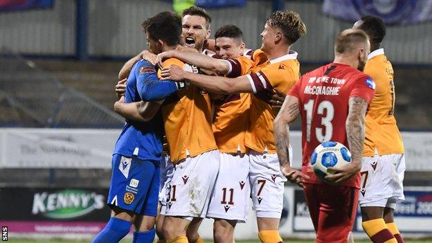 Trevor Carson is congratulated by his Motherwell team-mates