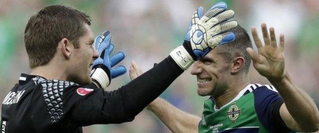 NI goalkeeper Michael McGovern and defender Aaron Hughes celebrate their win over Ukraine