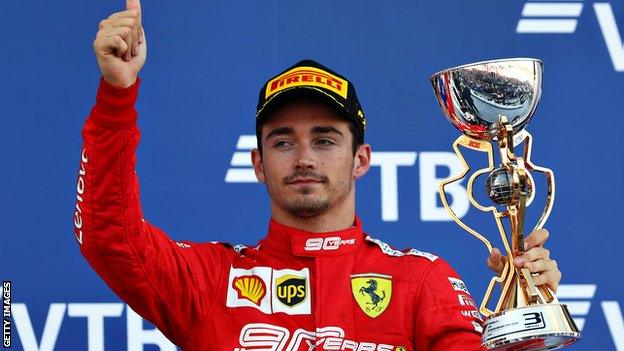 Charles Leclerc with the trophy for finishing third at Sochi