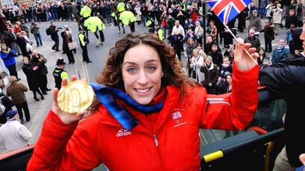 Amy Williams holding her gold medal