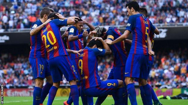 The moment after a Valencia fan throws a bottle at celebrating Barcelona players