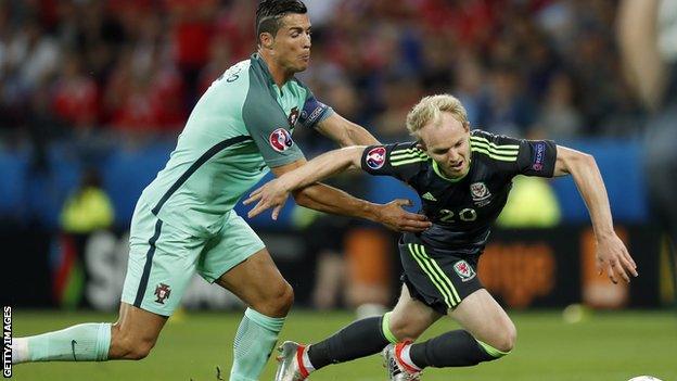 Jonny Williams is tackled by Cristiano Ronaldo