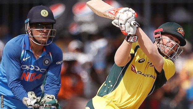 India's MS Dhoni and Australia's David Warner