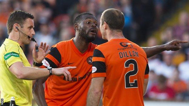 Wato Kuate argues with Dundee United captain Sean Dillon at referee Steven McLean looks on