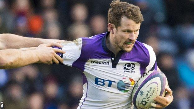 Peter Horne carries the ball for Scotland against France