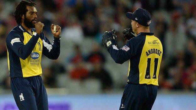 Recordo Gordon is congratulated by Bears wicketkeeper Tim Ambrose