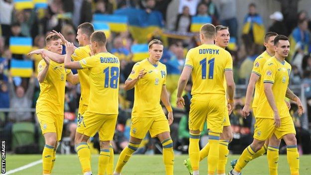 Ukraine players celebrate the winner