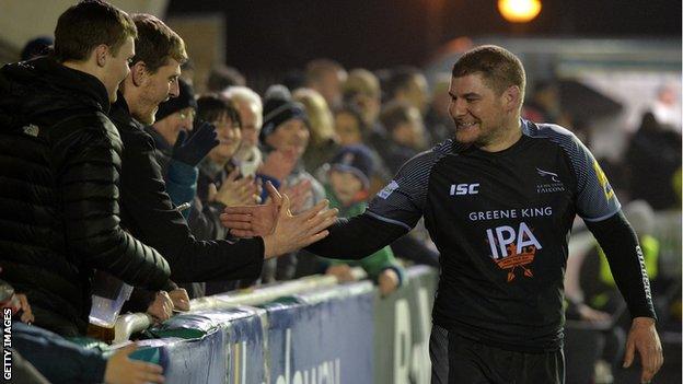 Rob Vickers (right) interacts with Newcastle fans after a match