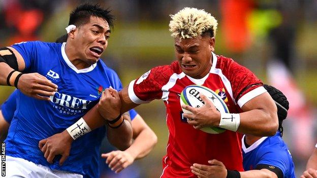 Viliami Taulani (right) in action for Tonga