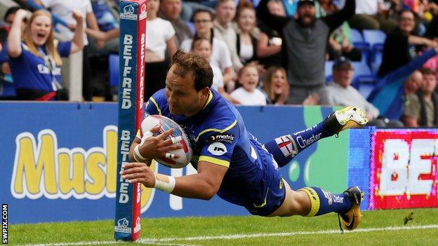 Tyrone Roberts scores a try for Warrington Wolves