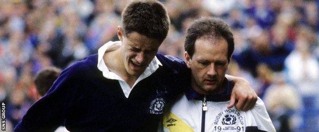 Robson assists Scotland winger Tony Stanger during the 1991 World Cup