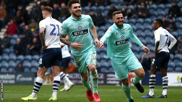 Ryan Manning, pictured here celebrating with former Swansea City star Angel Rangel, was linked with West Ham during the transfer window