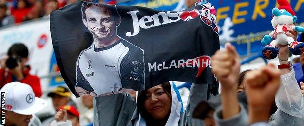 Fan with Jenson Button flag