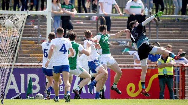 Eoin Donnelly (second from right) fists in Fermanagh's late clinching goal in Omagh