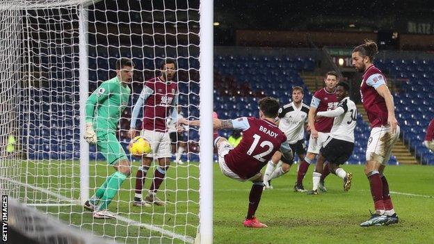 Ole Aina scores, despite Robbie Brady's attempted clearance on the line