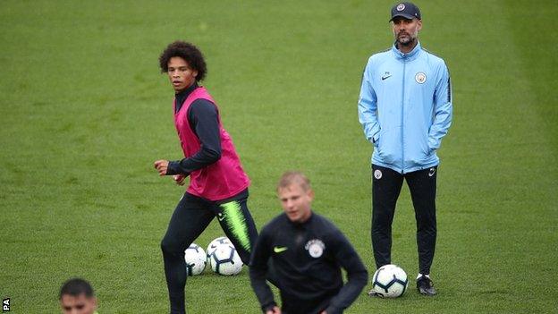 Pep Guardiola watches Manchester City training