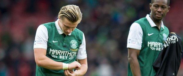 Striker Jason Cummings cut a disconsolate figure after the match at Hampden