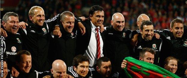 Chris Coleman and his Wales back room staff celebrate