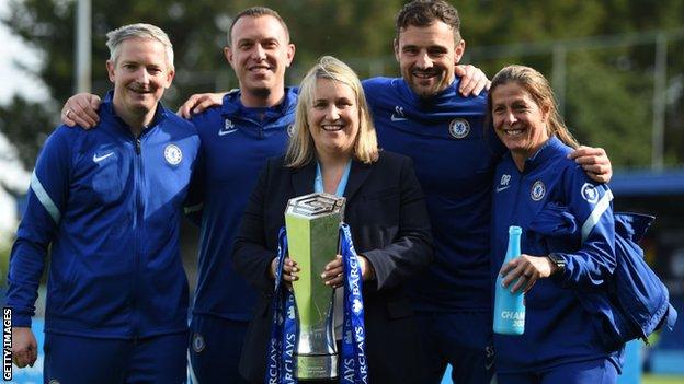 Chelsea staff with the WSL trophy