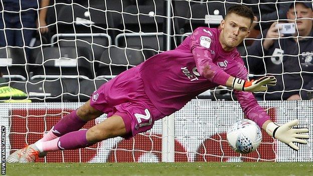 Freddie Woodman saves Martyn Waghorn's penalty
