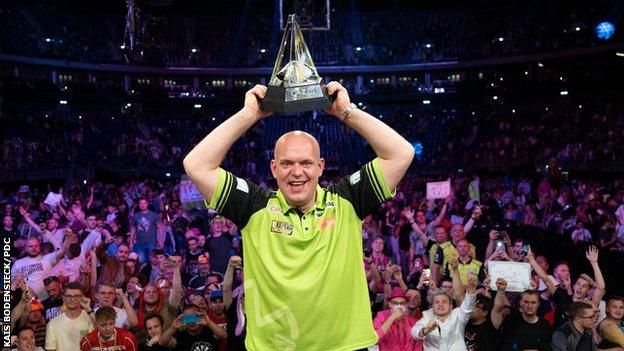 Michael van Gerwen celebrating with the trophy in Berlin