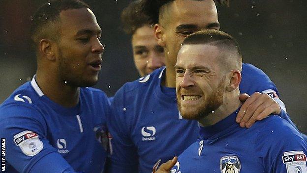 Jack Byrne celebrates a goal for Oldham