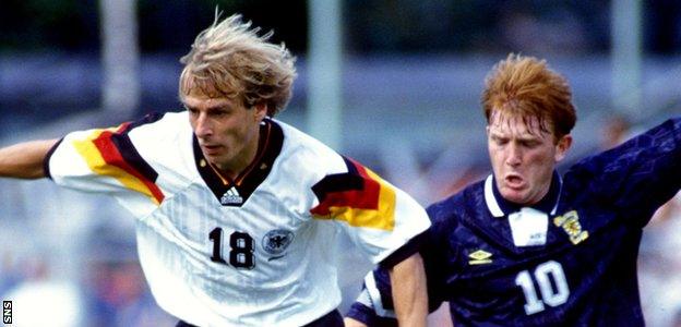Germany's Jurgen Klinsmann (left) skips past Stuart McCall