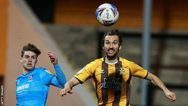 Harrison Dunk (right) in action for Cambridge United