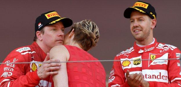 Kimi Raikkonen receives his trophy from Princess Charlene of Monaco