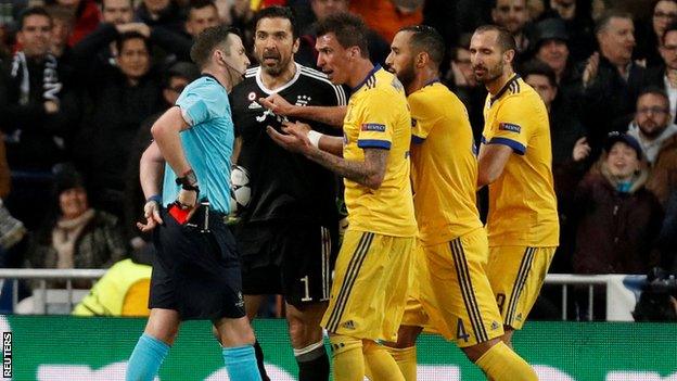 Gianluigi Buffon is shown the red card