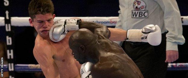 Luke Campbell takes a punch to the face from French boxer Yvan Mendy in December 2015