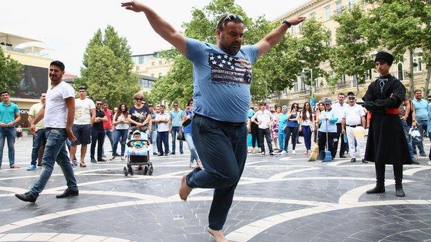 A man dances in the centre of azerbaijan's capital, Baku