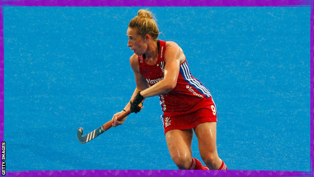 Susannah Townsend playing hockey