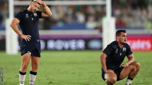 Scotland's Ali Price and Stuart McInally are left disconsolate against Japan