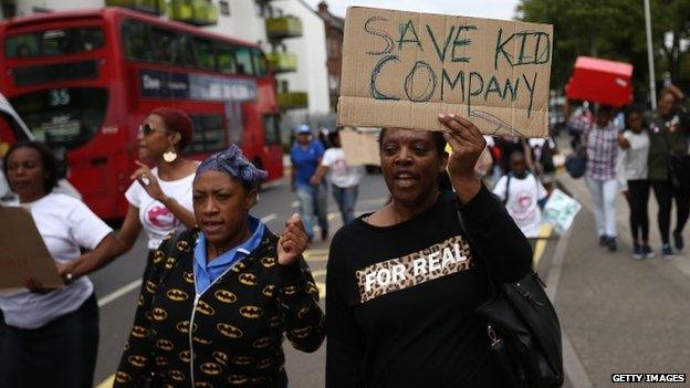 People with placards protesting against Kids Company's closure