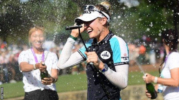 Nelly Korda being doused with champagne after winning the Women's PGA Championship