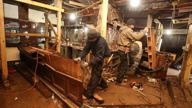 workmen clearing debris at Clutha