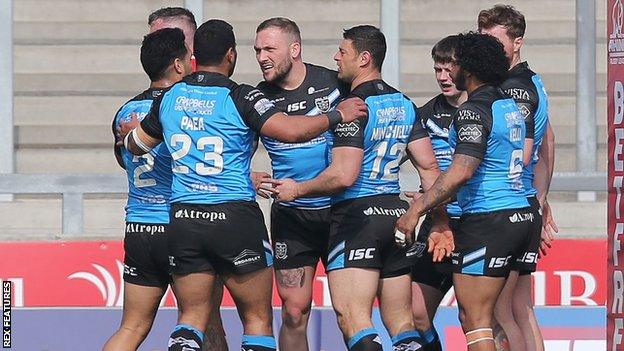 Hull FC celebrate Josh Griffin's opening try at Salford