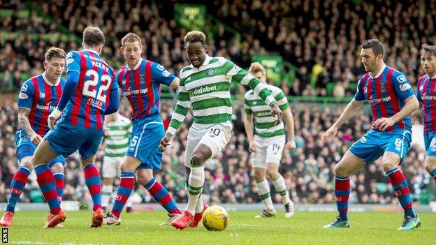 Celtic striker Moussa Dembele is tracked by a clutch of Inverness players in their league game at Celtic Park last November