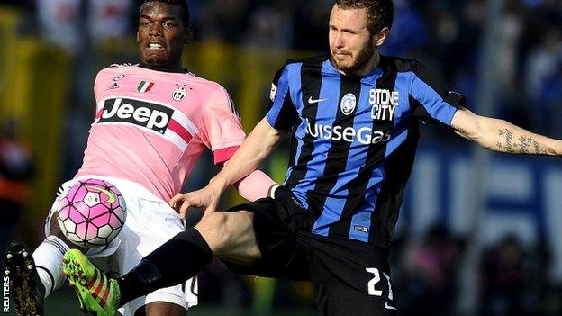 Paul Pogba of Juventus and Jasmin Kurtic of Atalanta