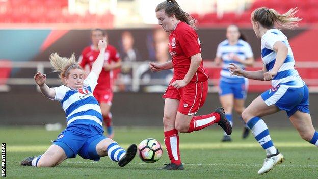 Lauren Hemp of Bristol City Women is tackled by Rachel Furness of Reading