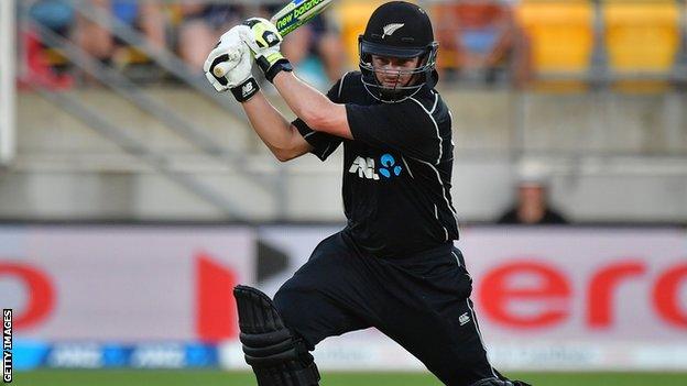 Colin Munro cuts the ball through the off-side for New Zealand against England