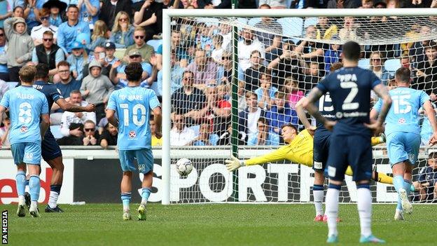 Huddersfield Town's Tino Anjorin (second left) scores against Coventry