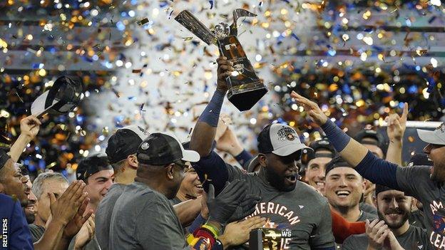 Houston Astros designated hitter Yordan Alvarez (centre) leads the celebrations after they won the ALCS