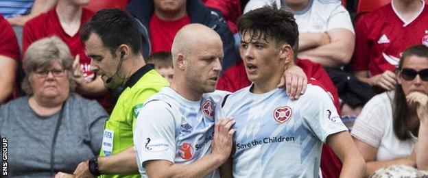 Steven Naismith consoles Aaron Hickey after the teenager's late red card at Pittodrie